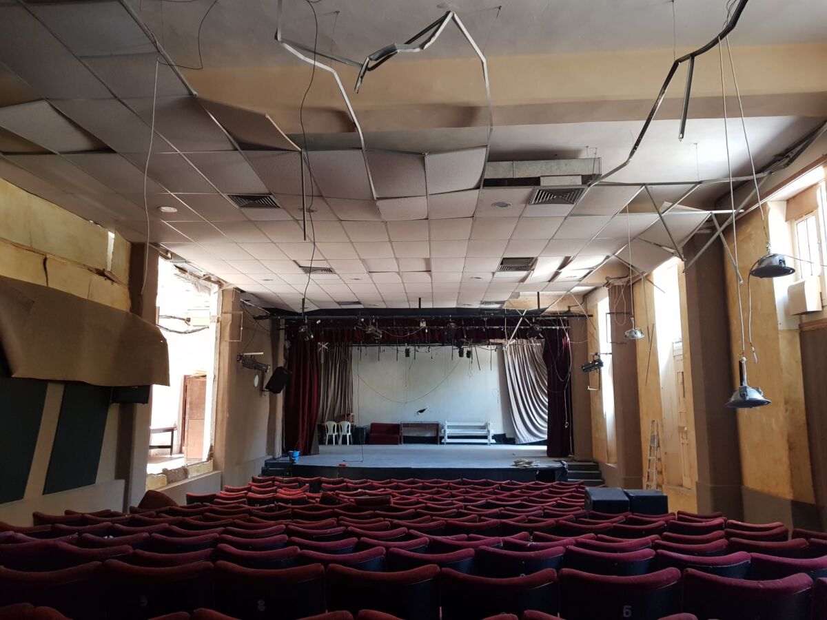 A colour image of a damaged theatre auditorium in Beirut