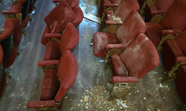 A picture of red velvet theatre seats covered in rubble following the explosion in the port of Beirut on 4 August 2020.