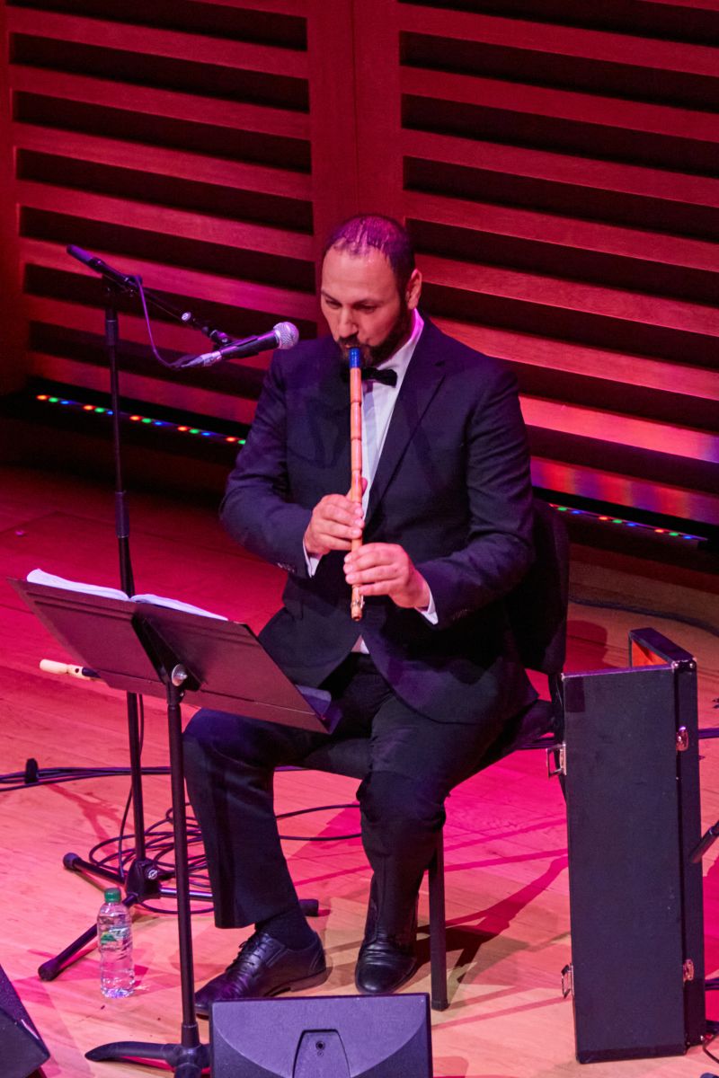 A musician playing a wind instrument.