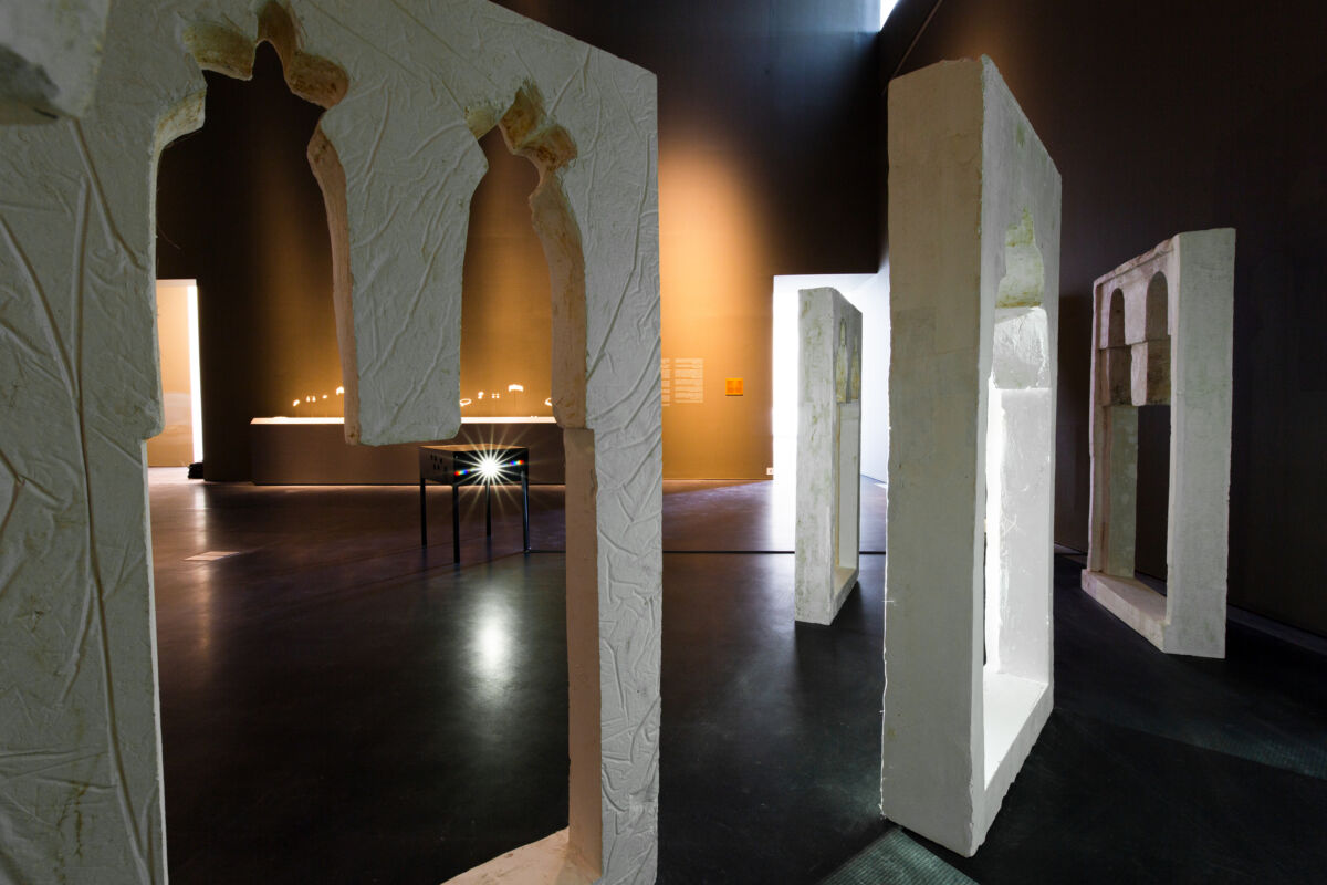 An image of an installation by the artist Rand Abdul Jabbar depicting large cast frames of the profile of a minuet