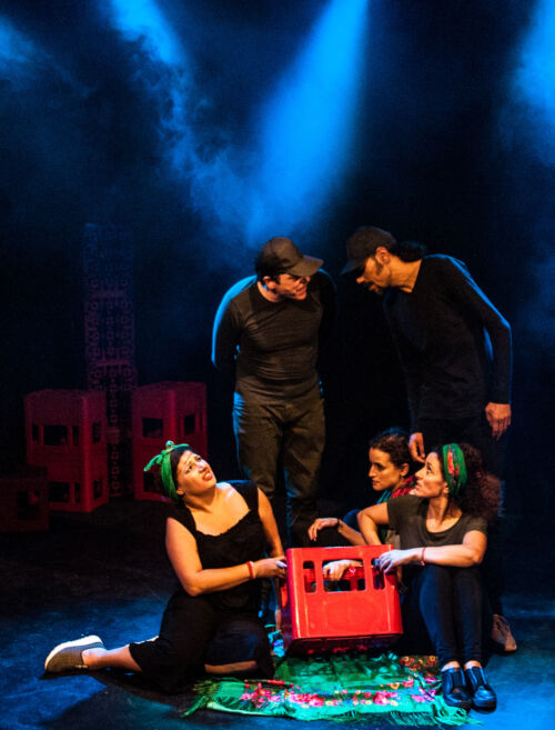 Scenes from Trouf: five people talking, holding a red crate