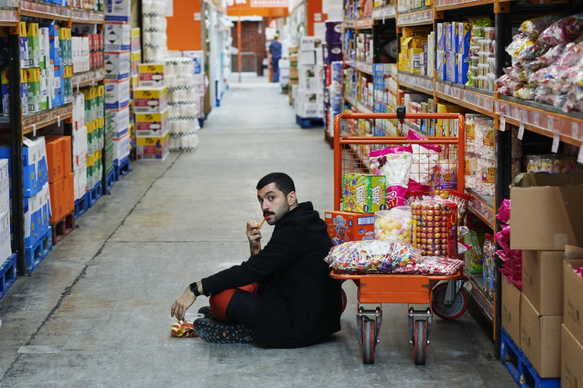 portrait of Hamed Sinno on a shop floor