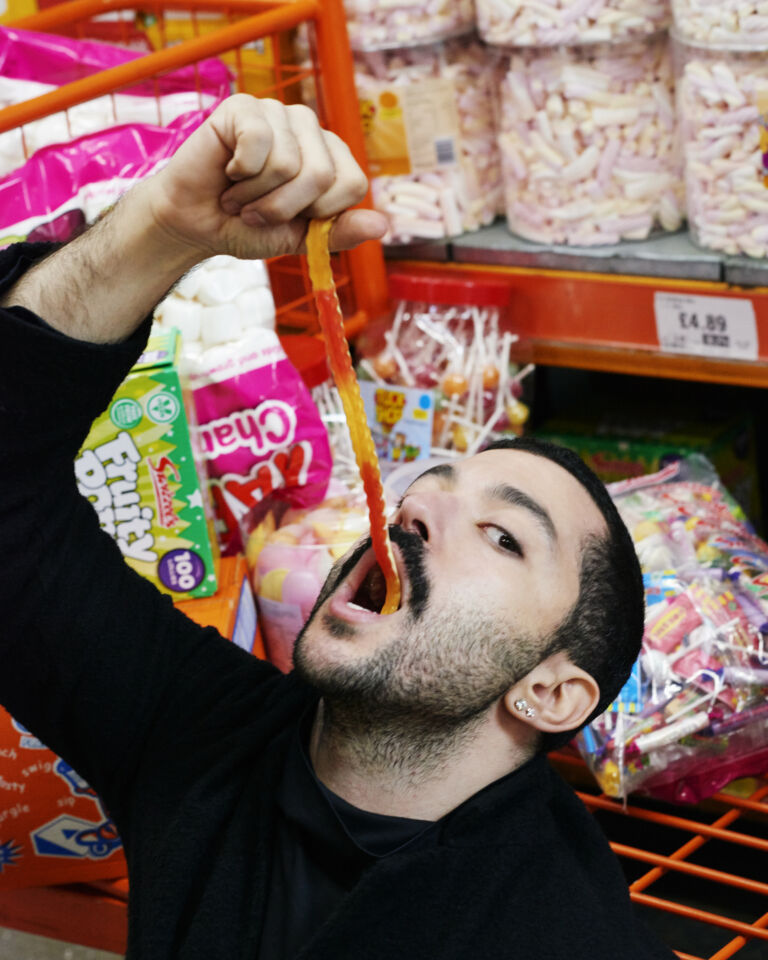 portrait of Hamed Sinno eating jelly snakes