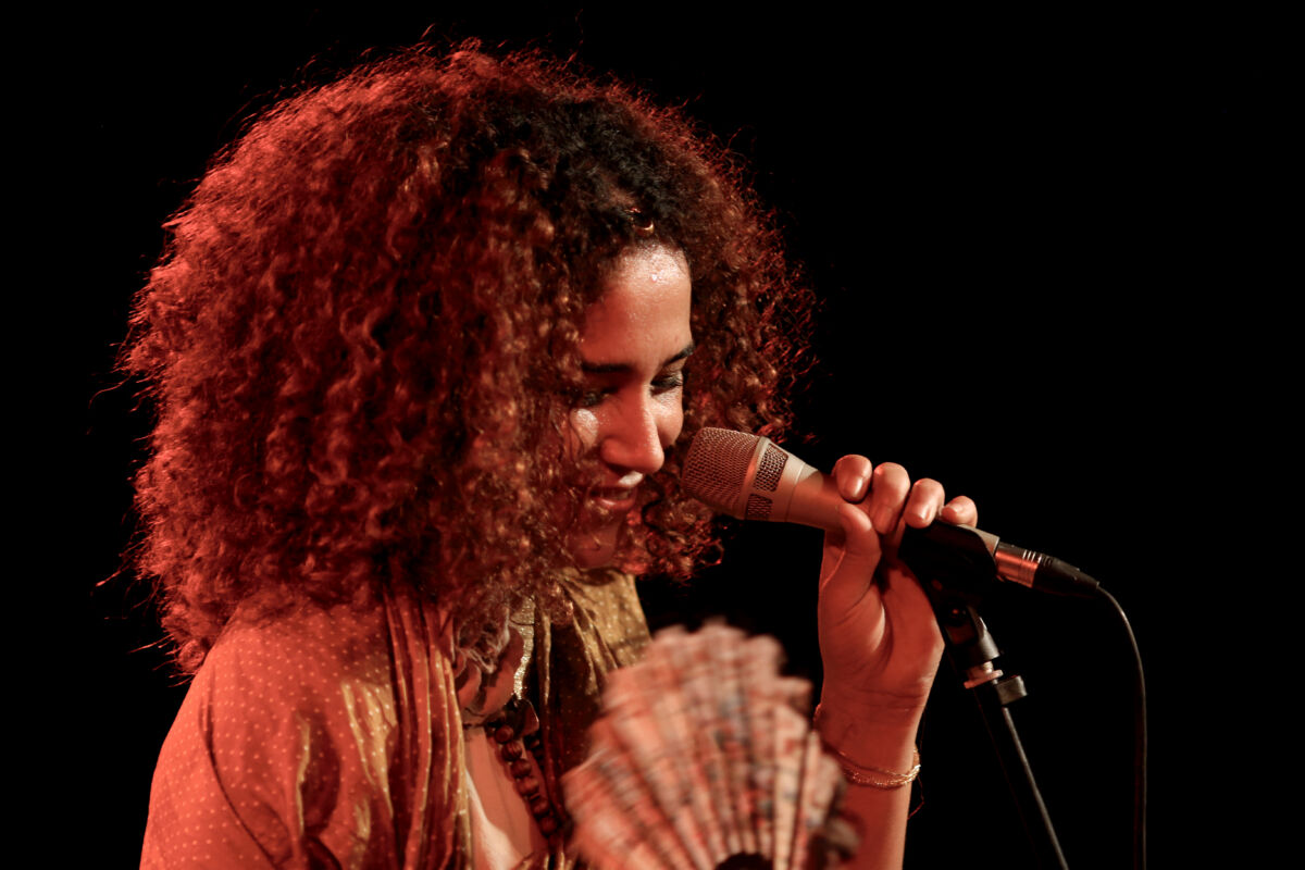 Image of Ghalia Benali holding a microphone