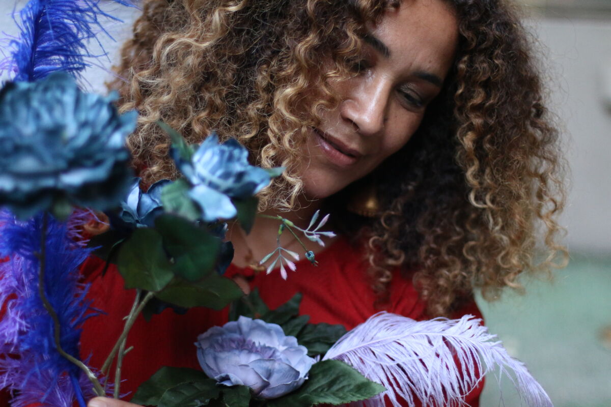 Photo of Ghalia Benali holding flowers