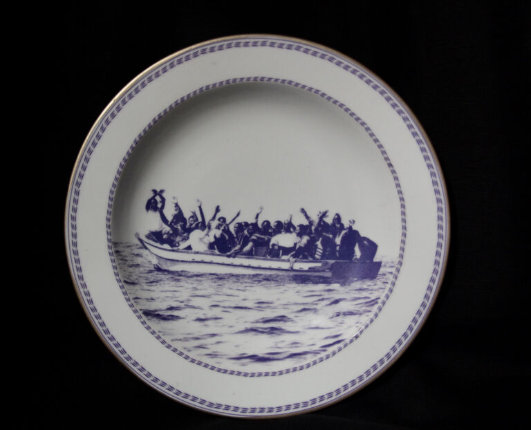 Plate with image of people on a boat
